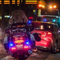 motorcycle cop tending to an accident